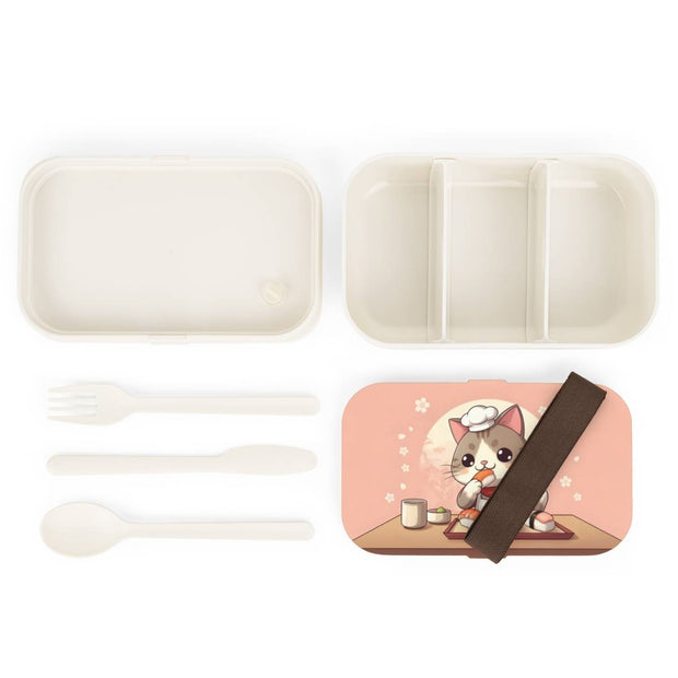 Bento box with a manga style design representing a cat eating sushi, components