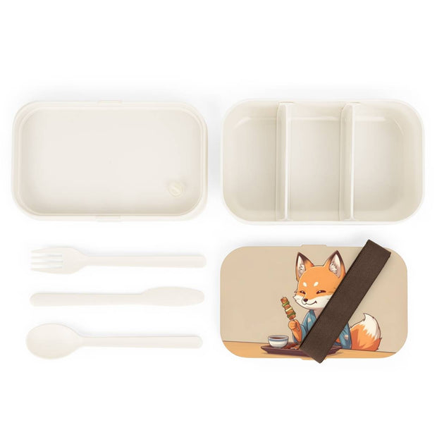Bento box with a manga style design representing a fox eating yakitori, components