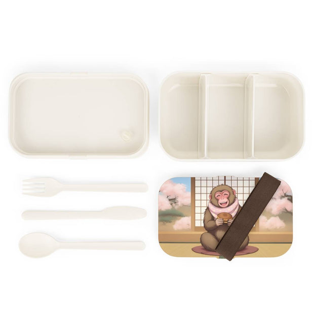 Bento box with a manga style design representing a macaque eating dorayaki, components