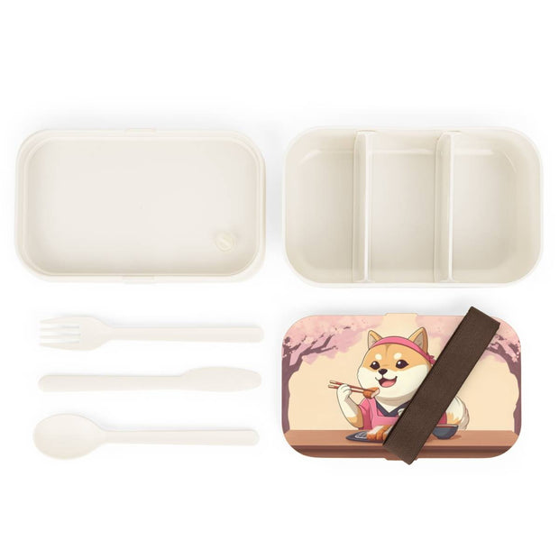 Bento box with a manga style design representing a Shiba Inu eating tonkatsu, components