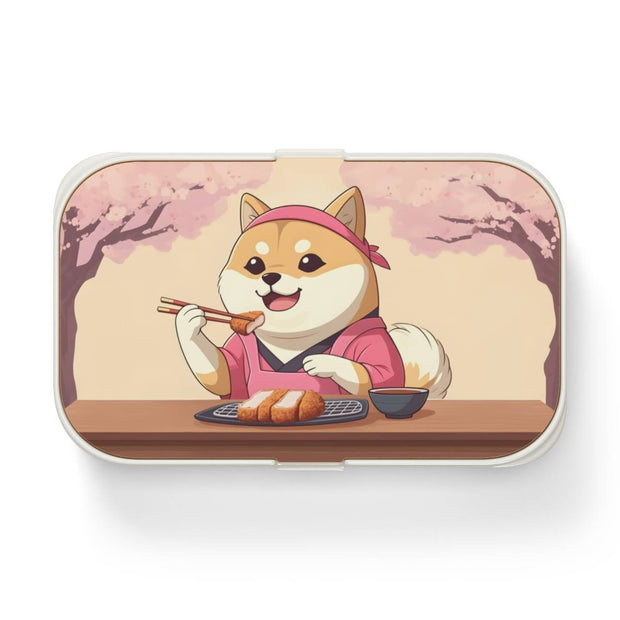 Bento box with a manga style design representing a Shiba Inu eating tonkatsu, front
