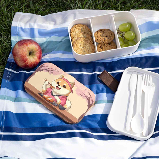 Bento box with a manga style design representing a Shiba Inu eating tonkatsu, lifestyle