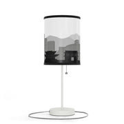 Lamp on a stand with Himeji's skyline design, left