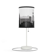 Lamp on a stand with Sapporo's skyline design, left