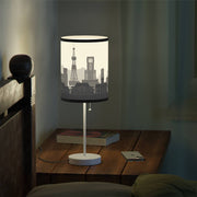 Lamp on a stand with Sapporo's skyline design, night-time