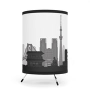 Tripod lamp with Tokyo's skyline design, left