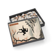 Jigsaw puzzle illustrating the Japanese proverb "Even monkeys fall", box